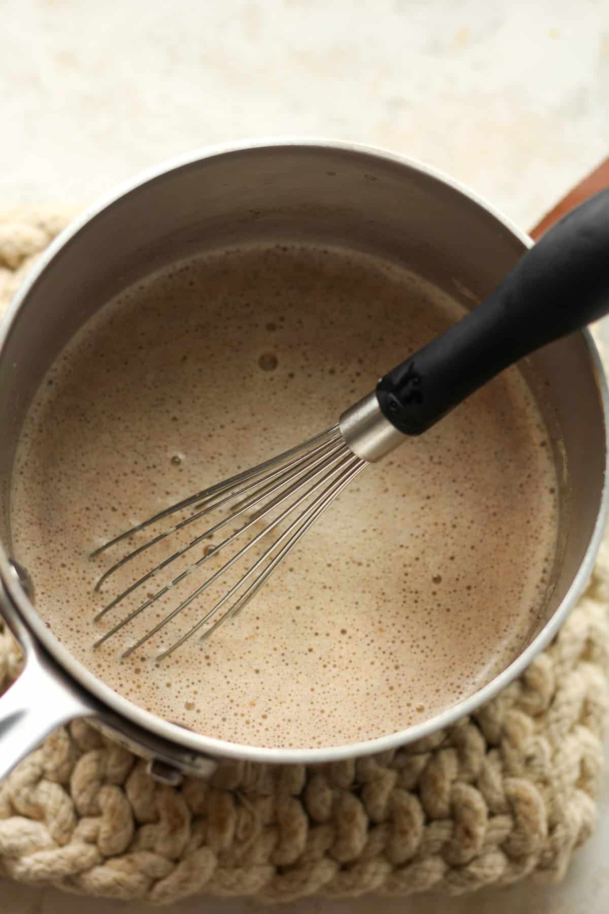 A small pan of the tempered egg mixture plus cinnamon.