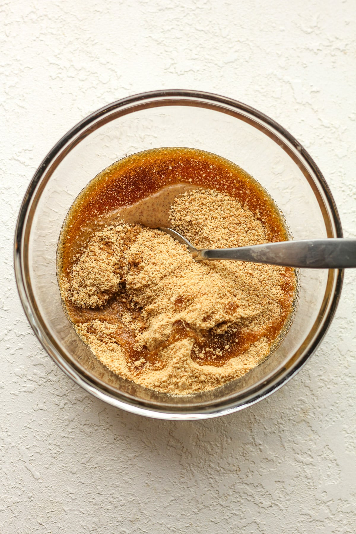 A bowl of the peanut butter mixture before stirring.