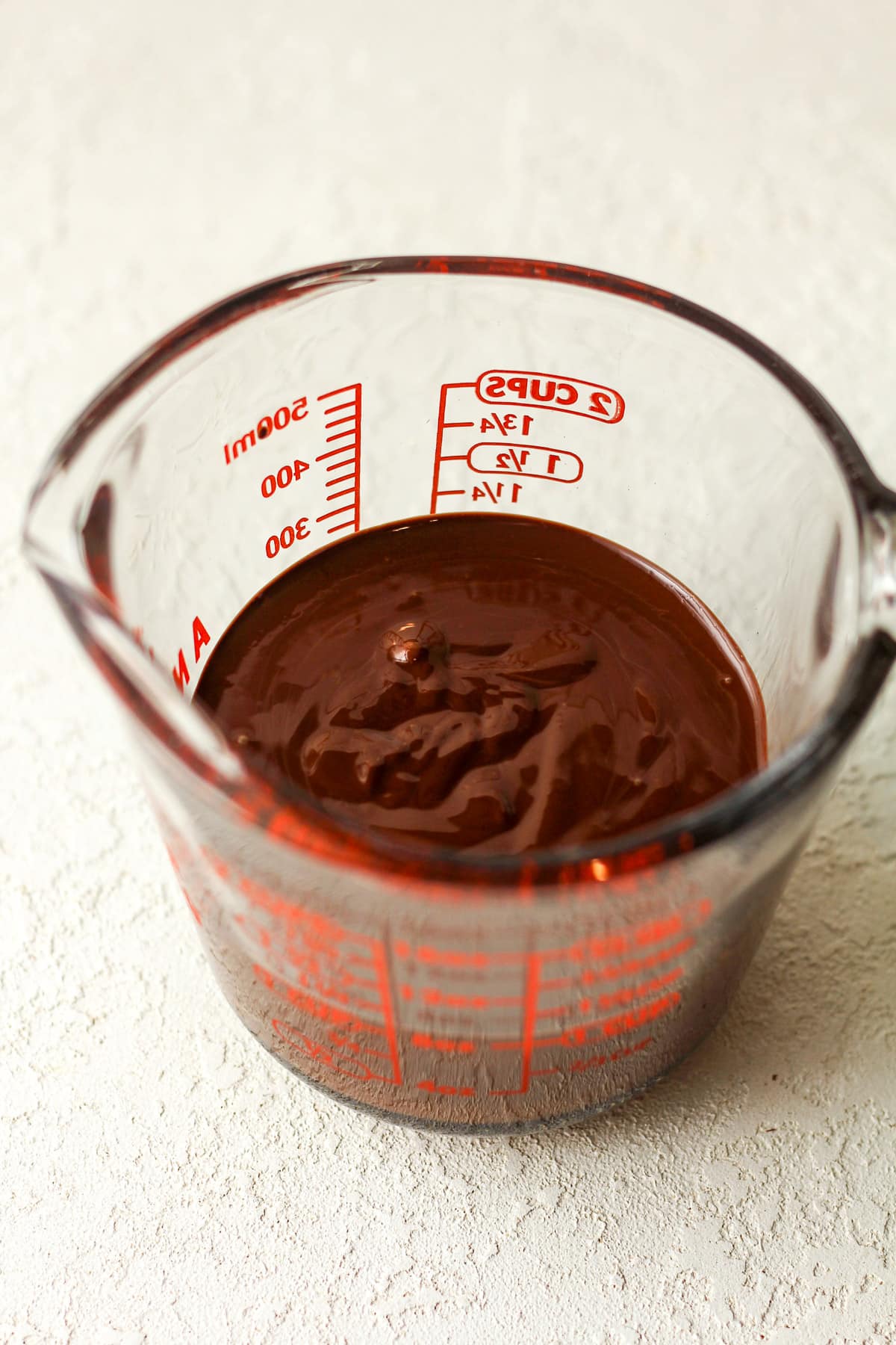 A measuring cup of the chocolate mixture.