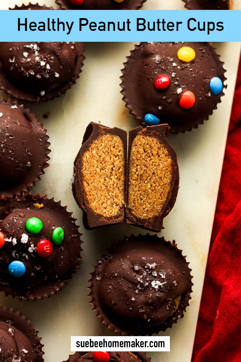 Overhead view of a halved healthy peanut butter cup with others on a tray.