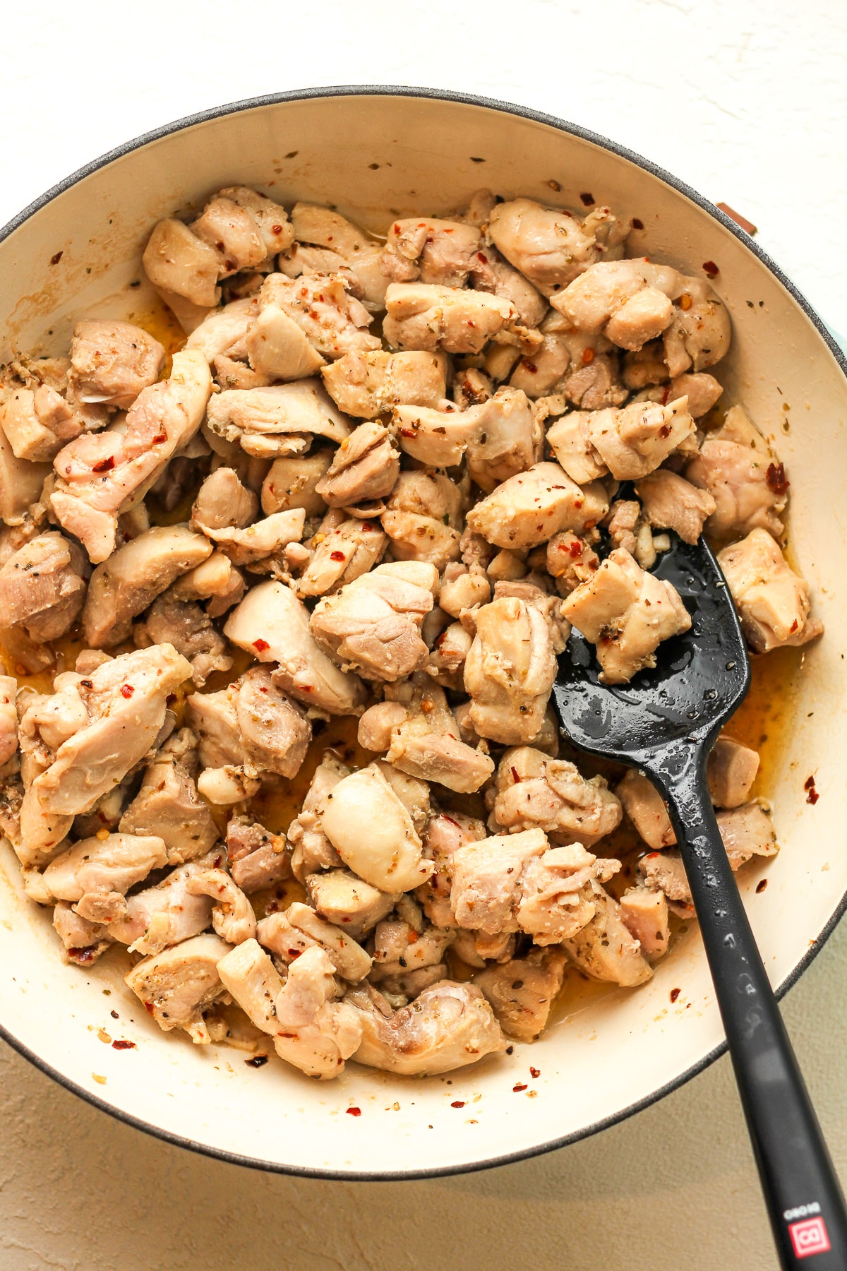 A pot of the sautéed chicken thighs.