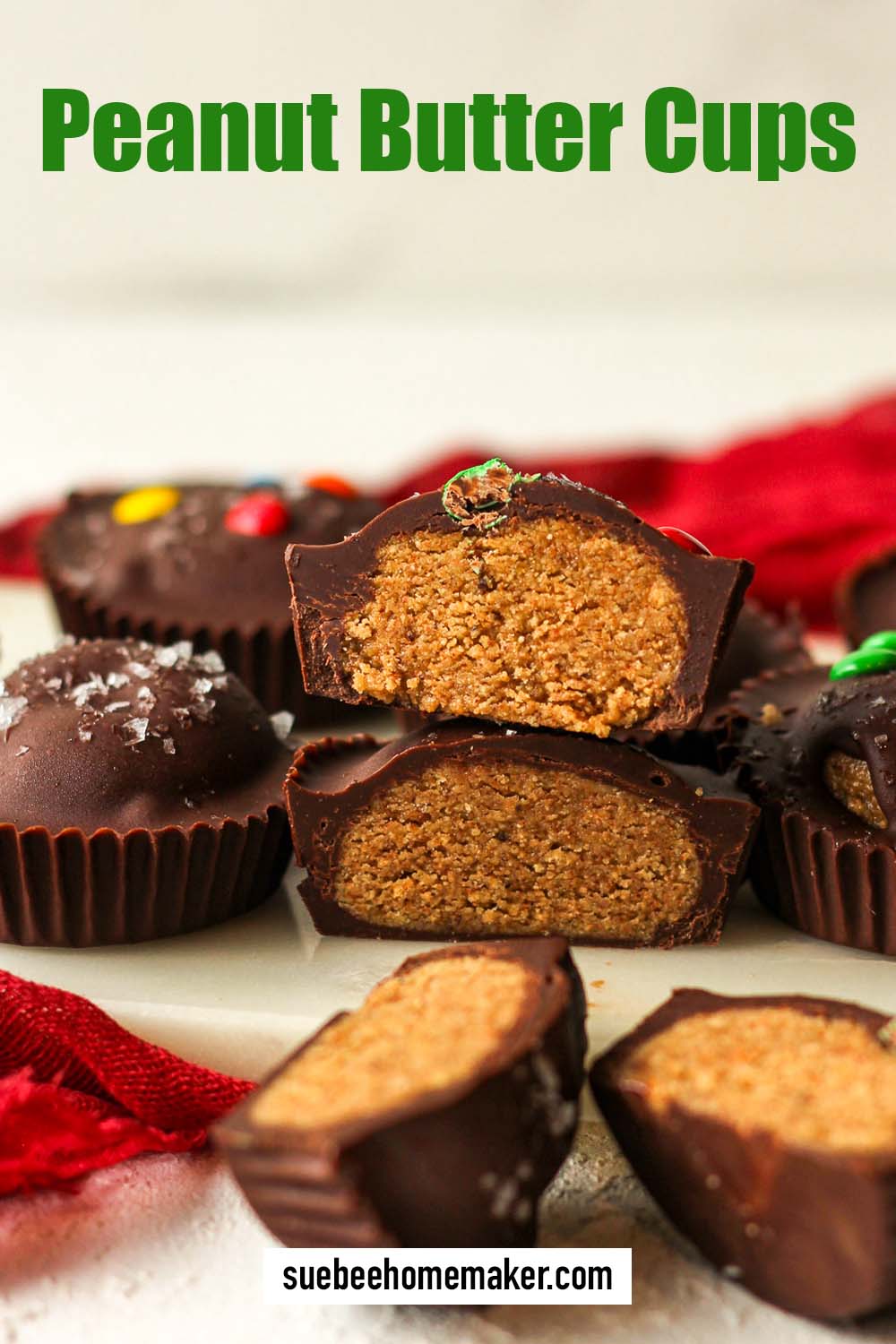 Side view of a halved peanut butter cup with other cups nearby.