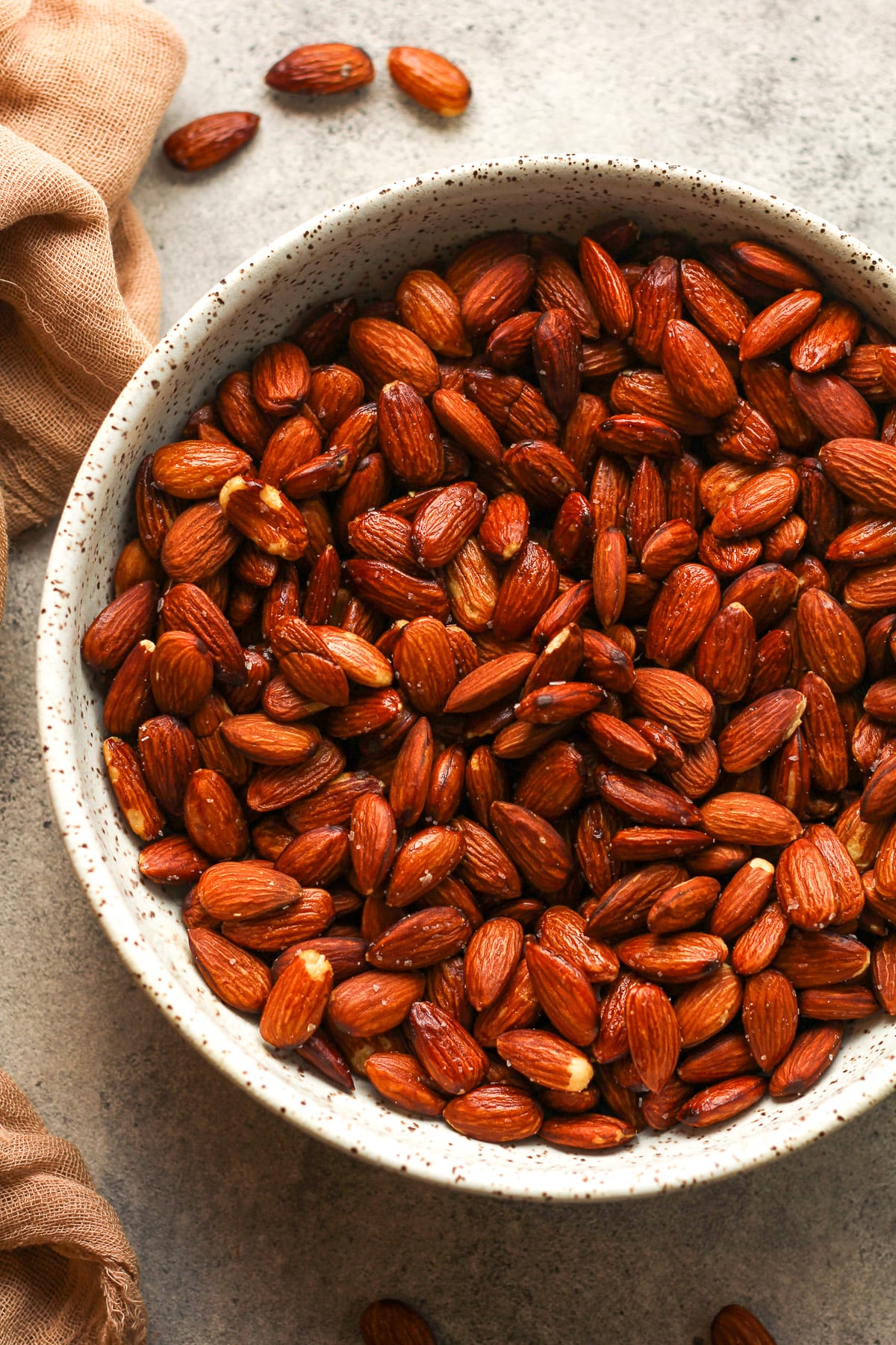 Closeup on a bowl of smoked almonds.