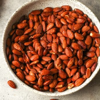 A bowl of smoked almonds.