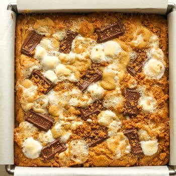 A pan of just baked s'mores cookie bars.
