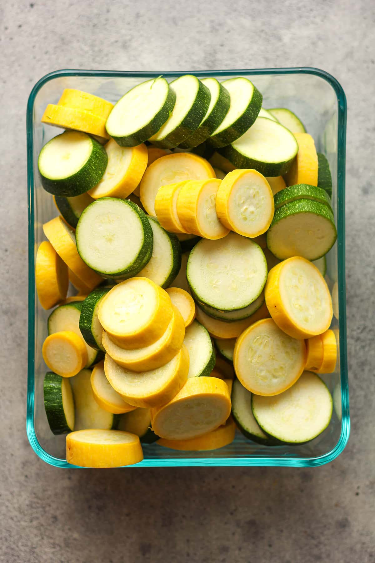 A rectangular dish with sliced squash.