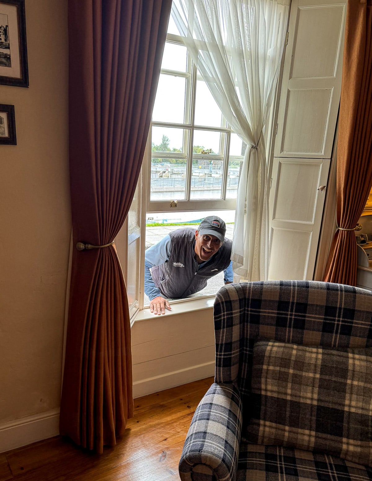 Mike peeking in a window of the airbnb.