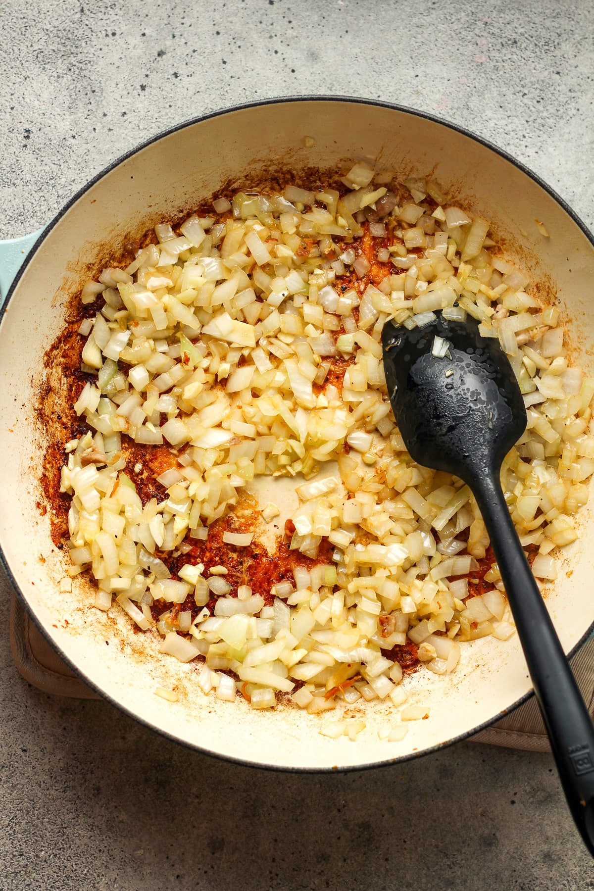 A skillet of the softened onions and garlic.