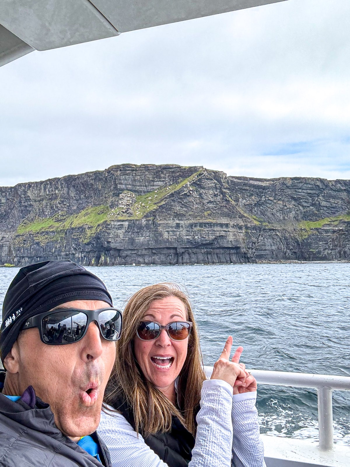 Mike and I in a ferry on the ocean by the cliffs.