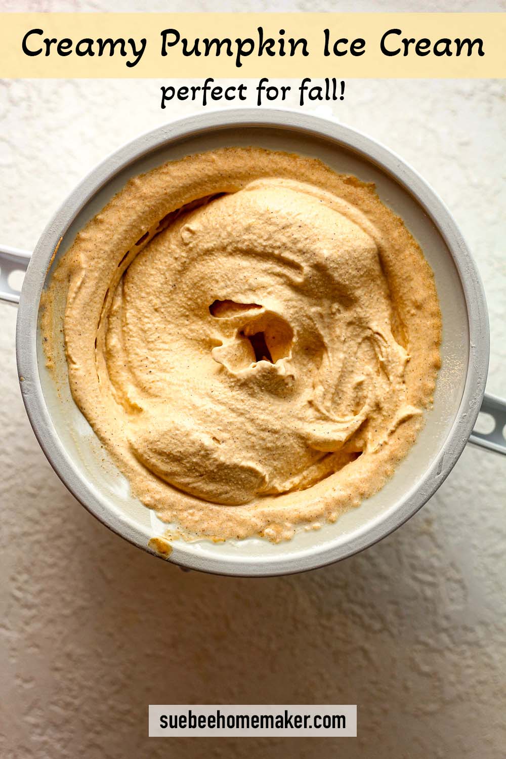 An ice cream churner of pumpkin ice cream.