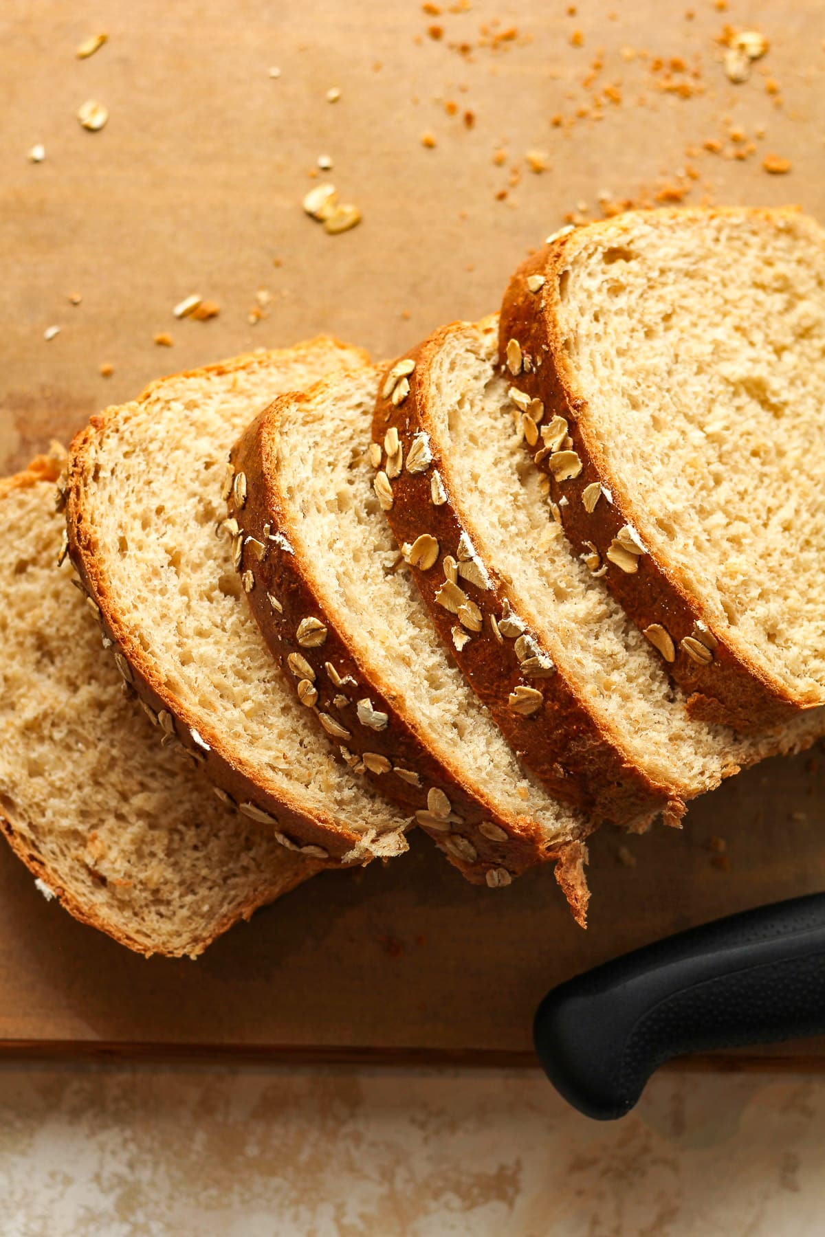 Overhead view of some sliced oatmeal bread.