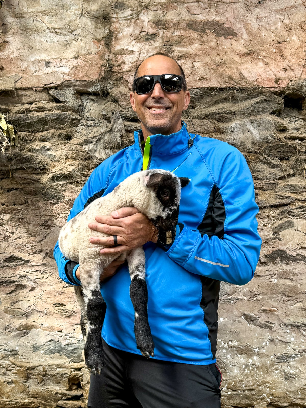 Mike holding a baby lamb.