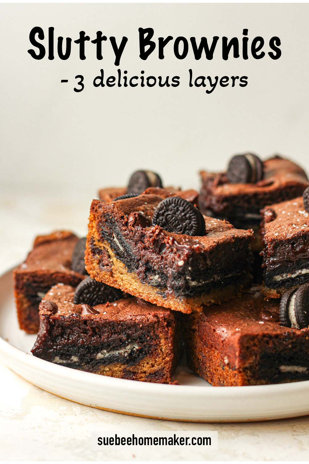 Side view of a plate of slutty brownies with three delicious layers.