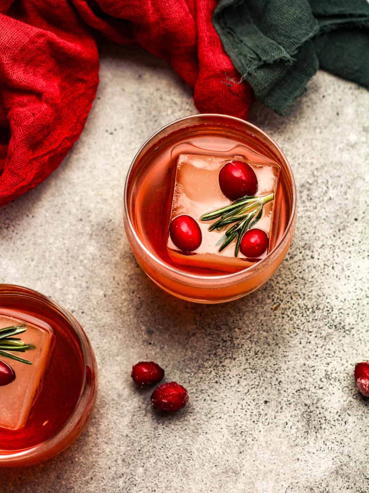 Overhead view of cranberry old fashioned drinks.