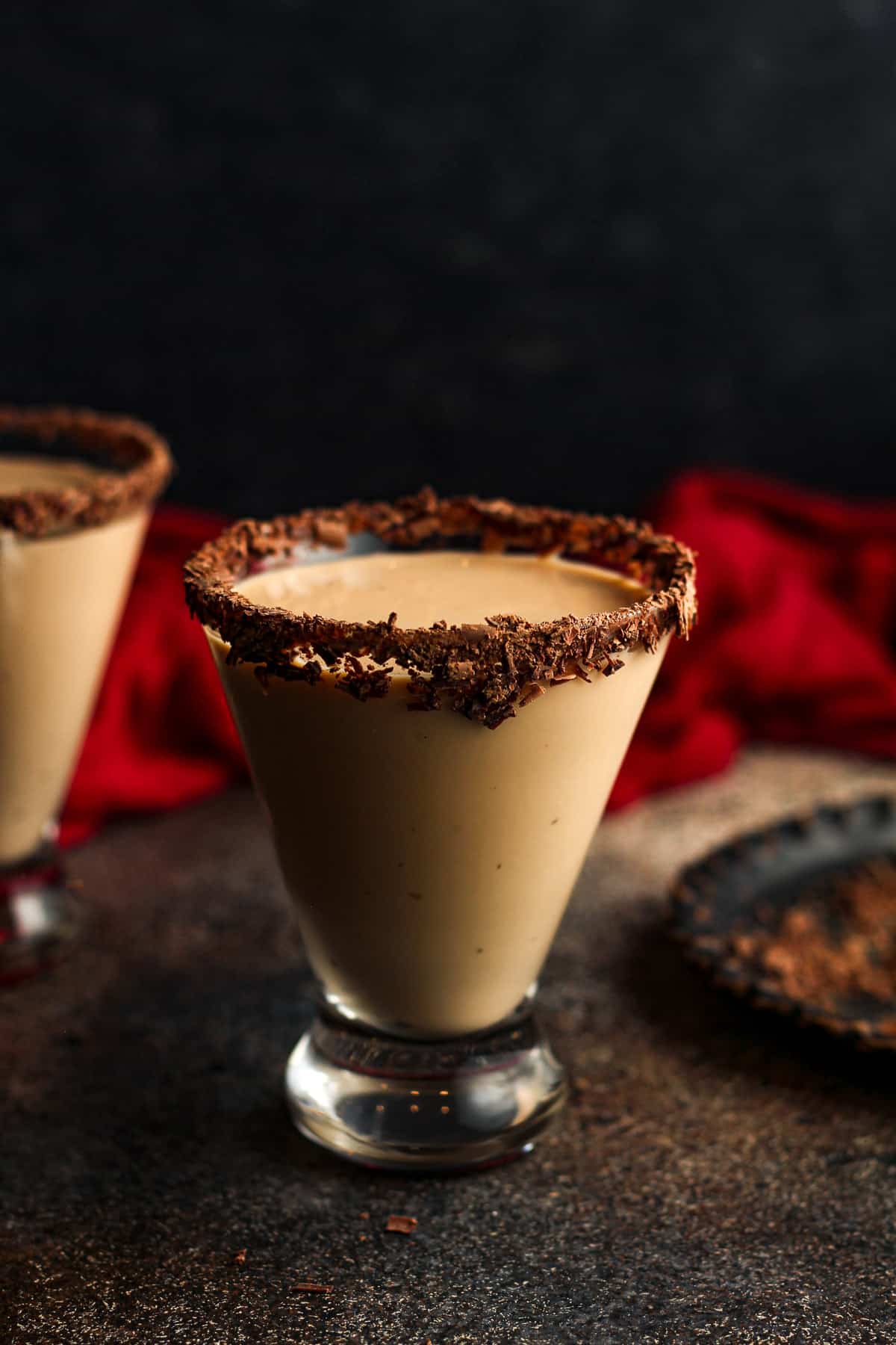 Side view of a chocolate martini with chocolate shavings on the rim.