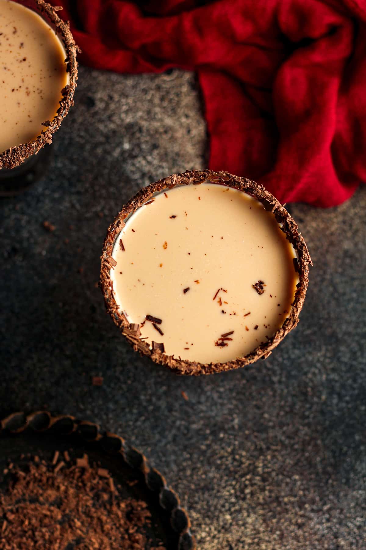 Overhead view of two chocolate martinis with a red napkin.