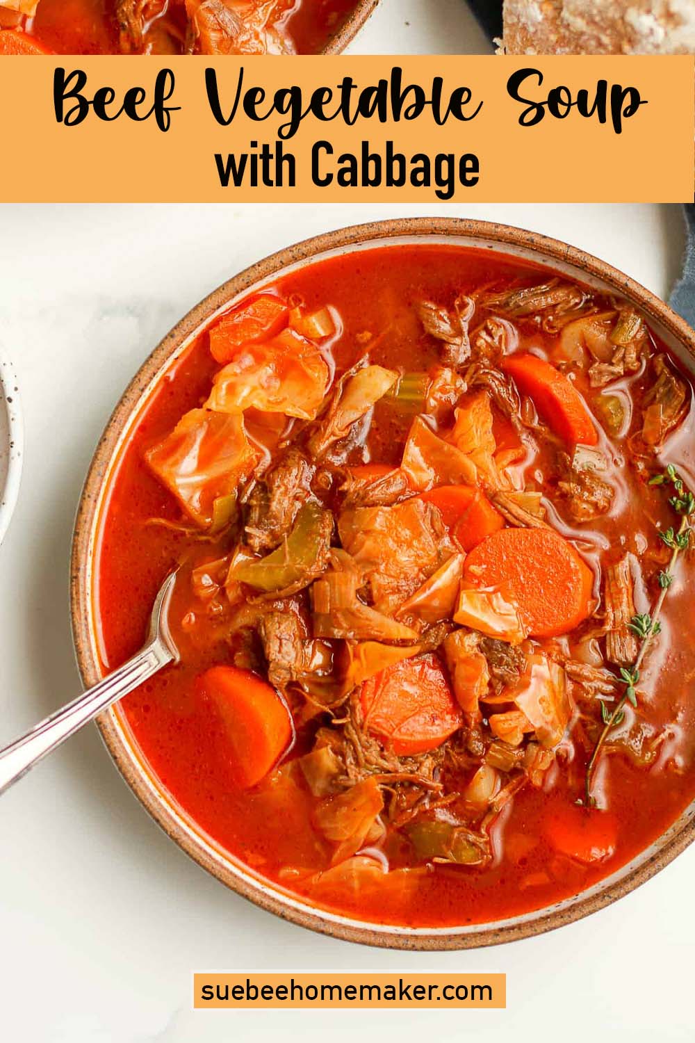 A bowl of beef vegetable soup with cabbage.