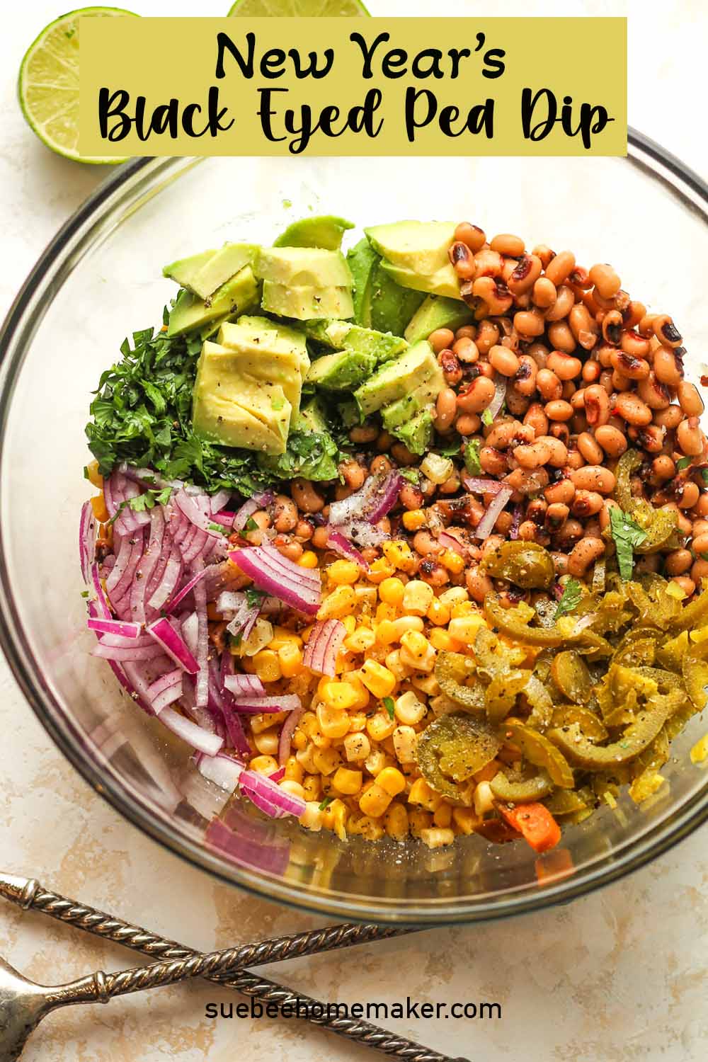 A glass bowl of New Year's Black Eyed Pea Dip.