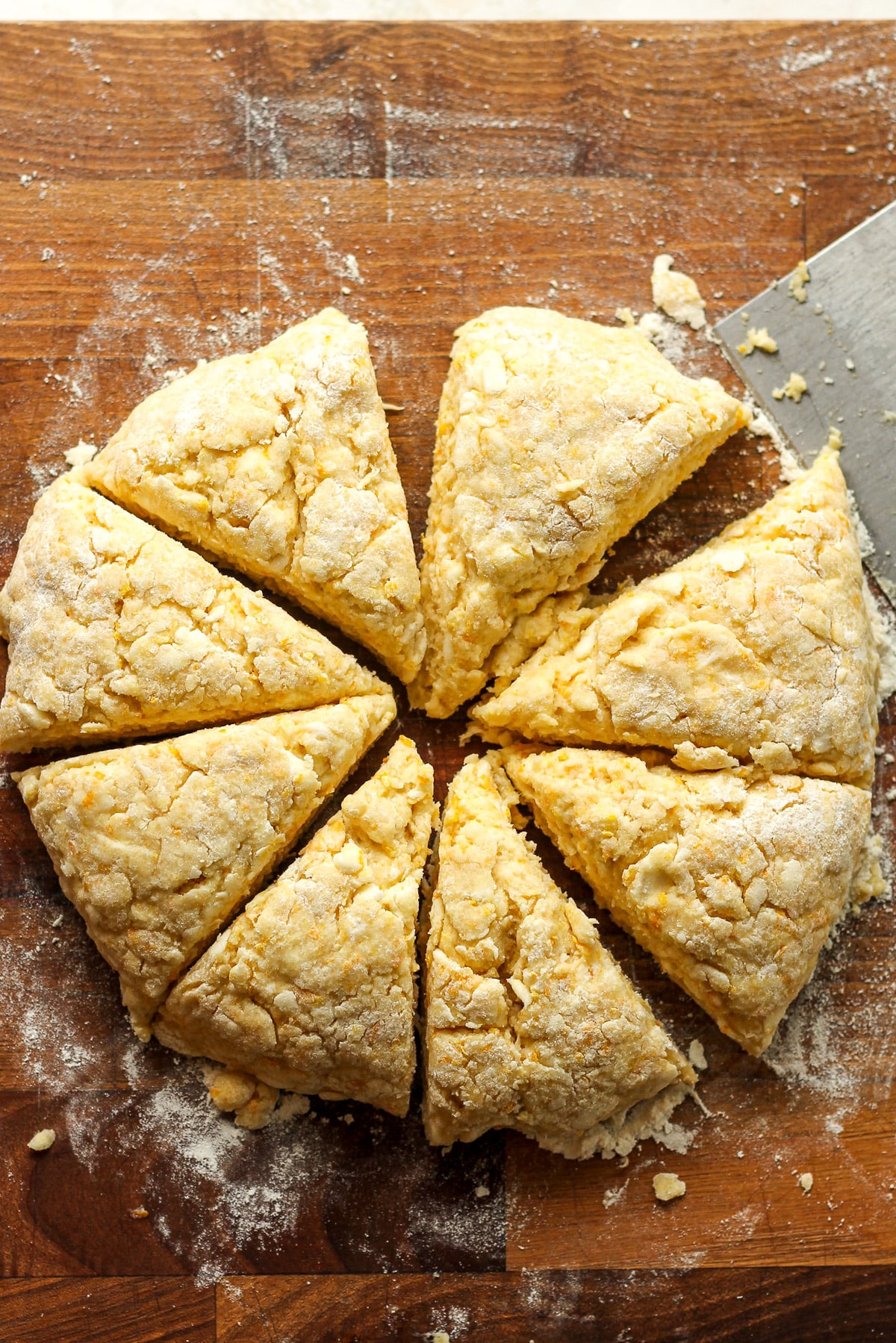 A round of scone dough cut in 8 triangles.