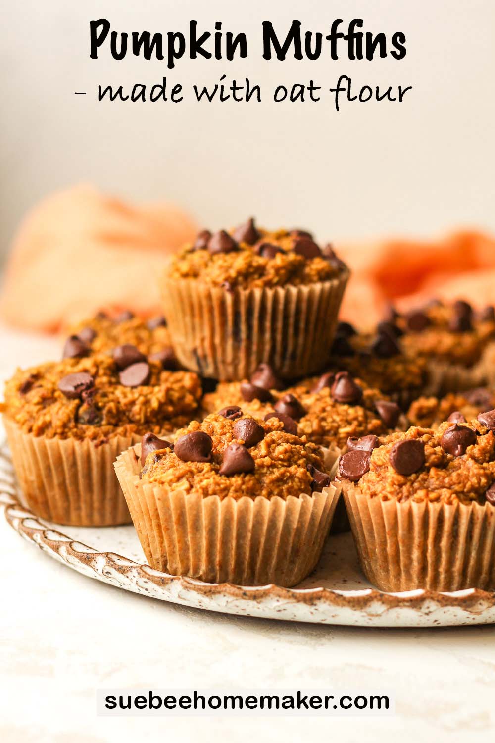 Side view of a plate of pumpkin muffins made with oat flour.