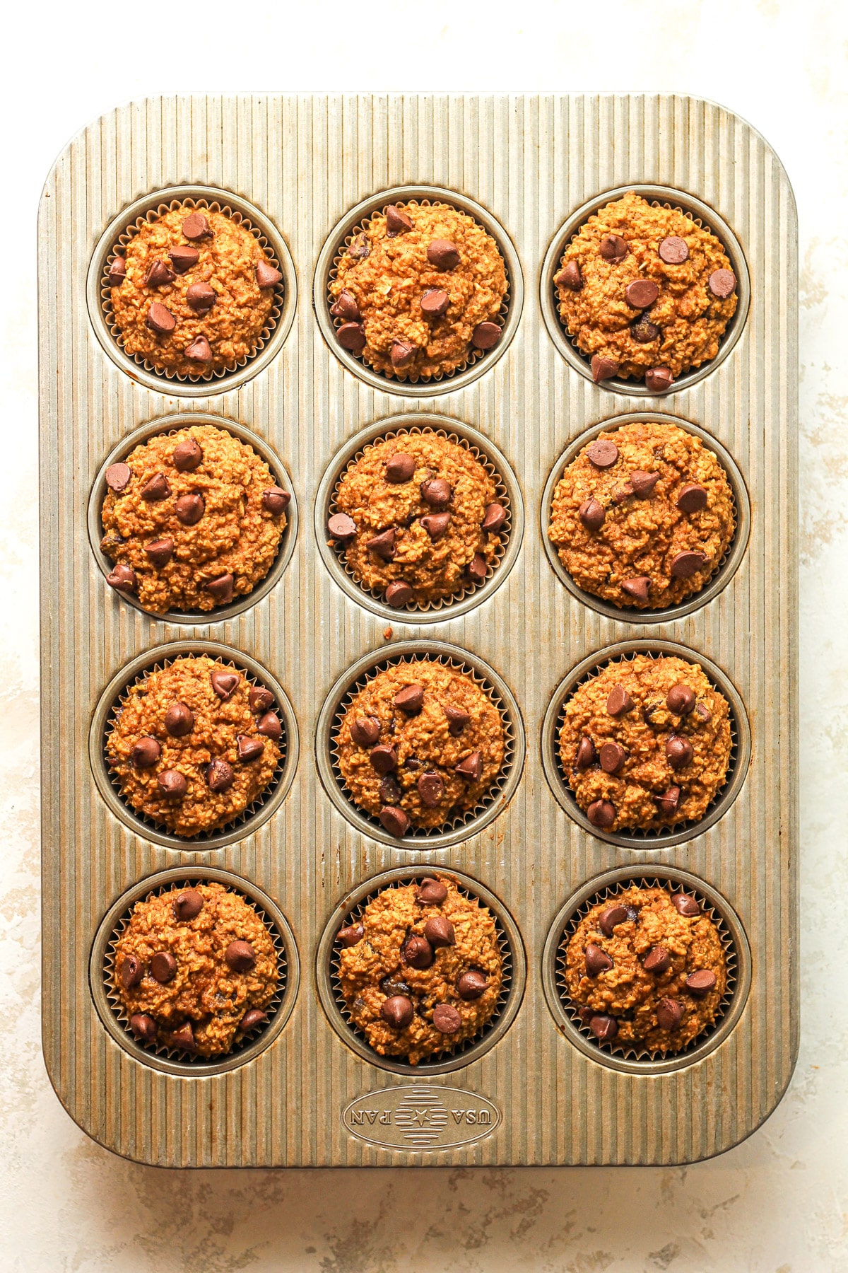 The muffin tin with the baked muffins.