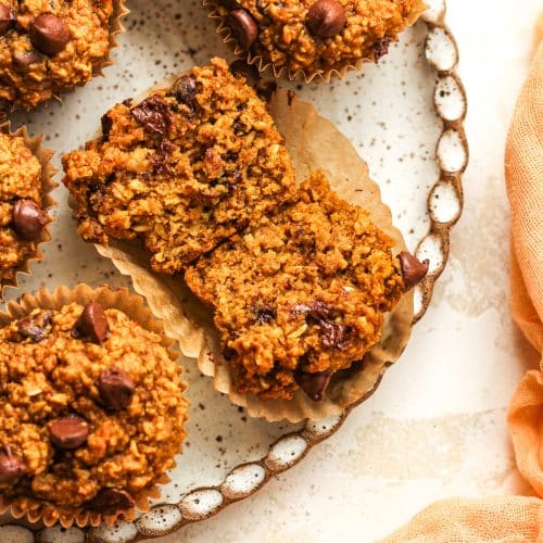 A plate of the muffins with one split in half.