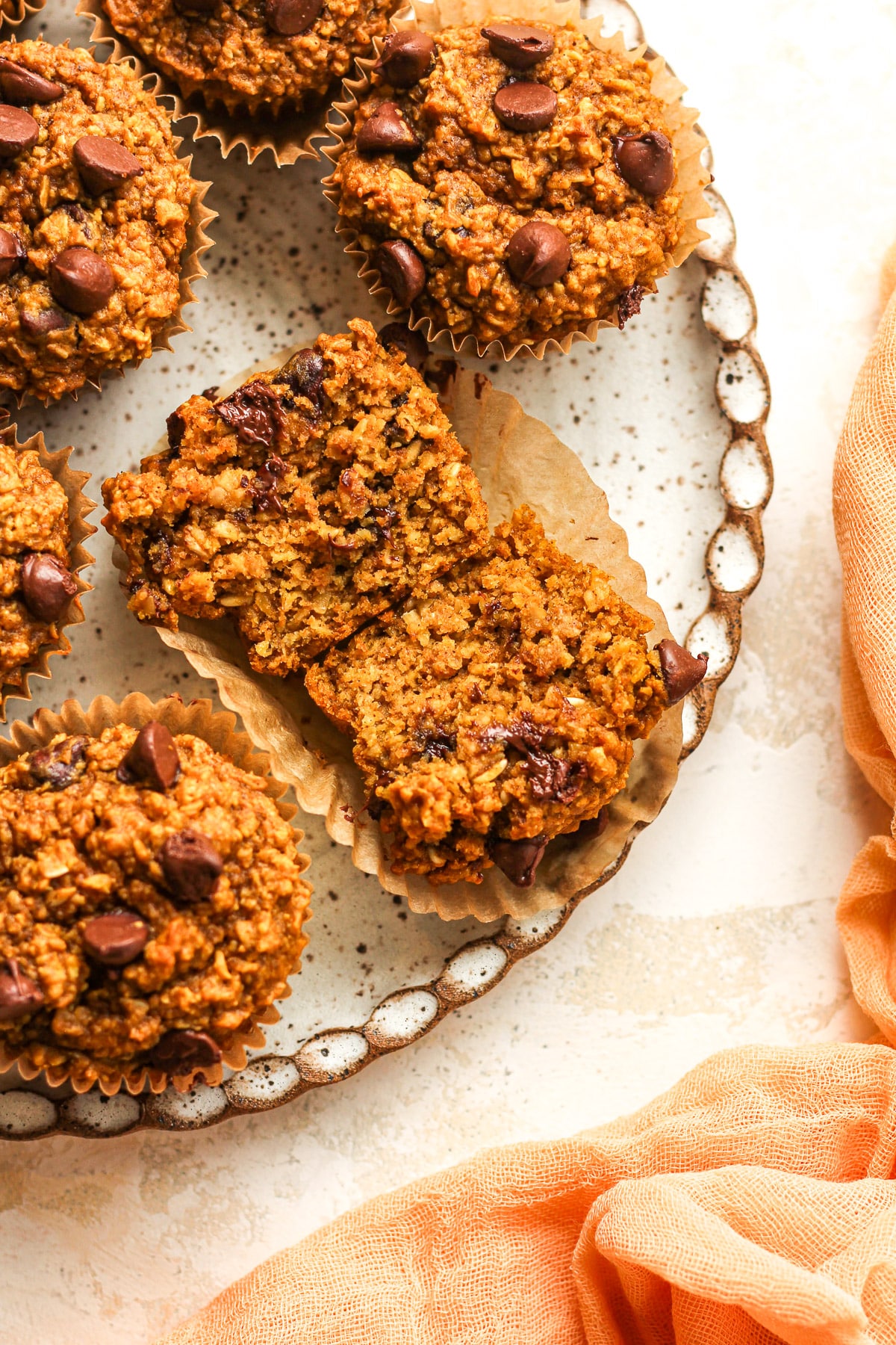 A plate of the muffins with one split in half.