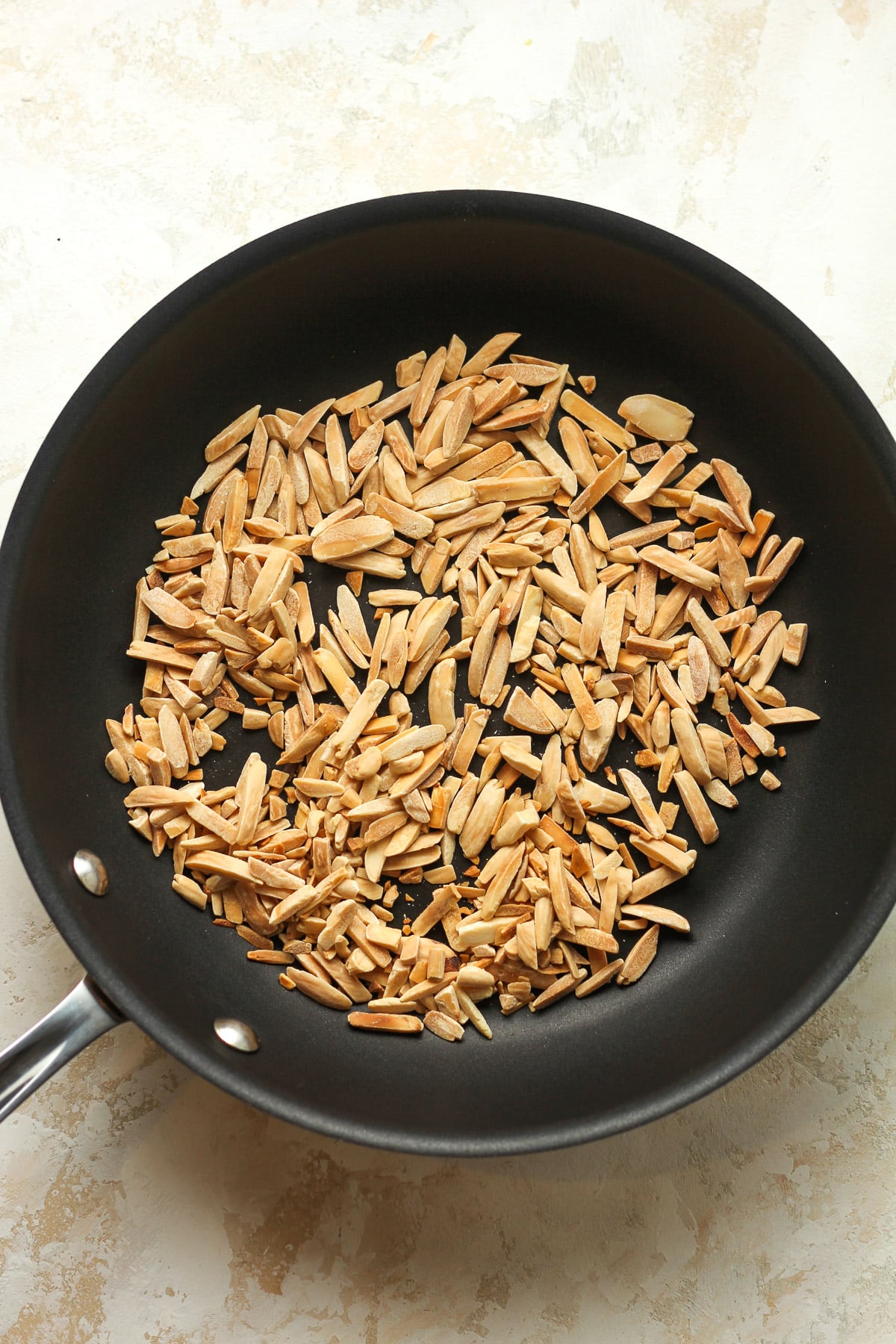 A pan of toasted slivered almonds.