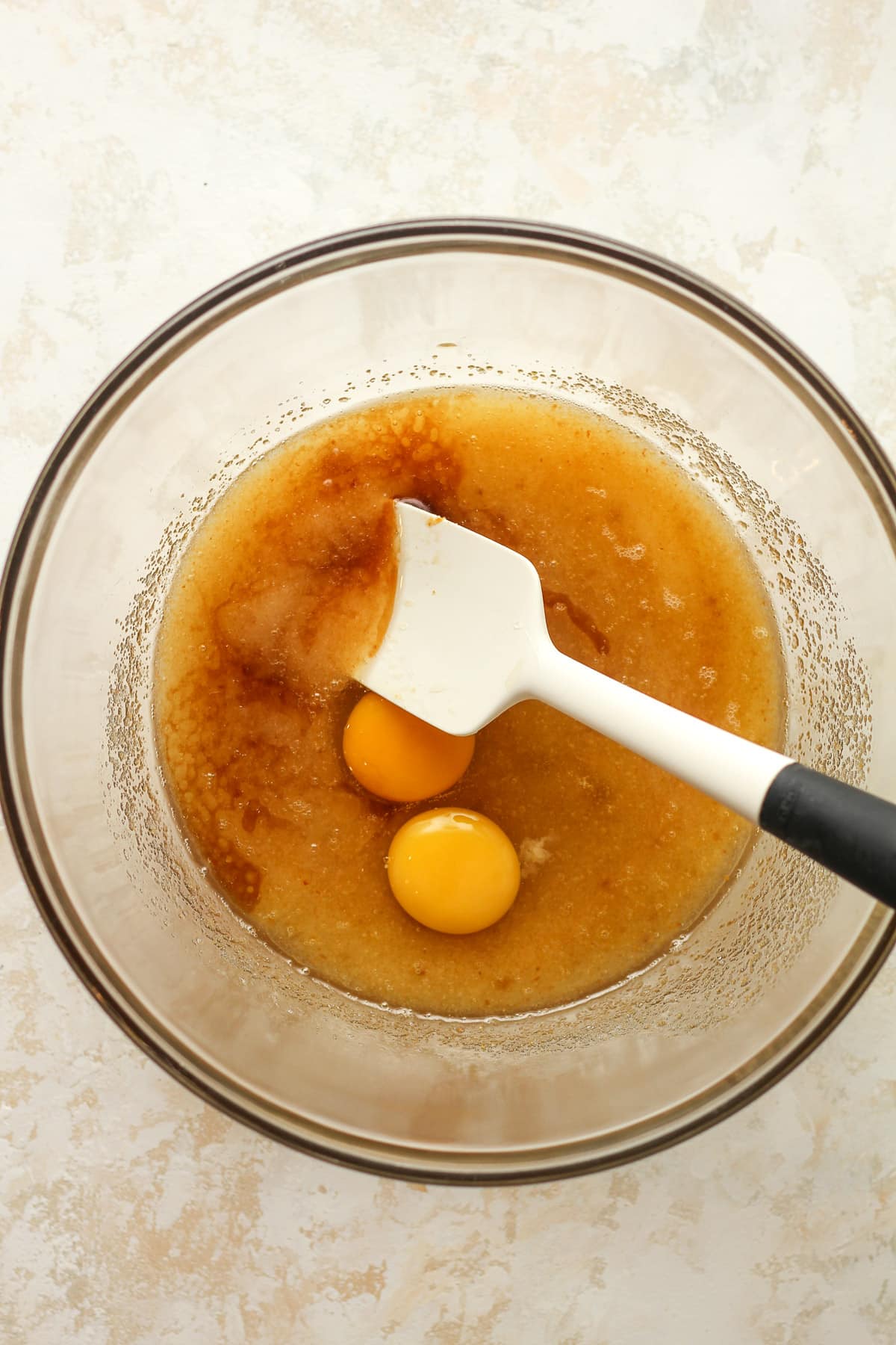 A large bowl with wet ingredients.