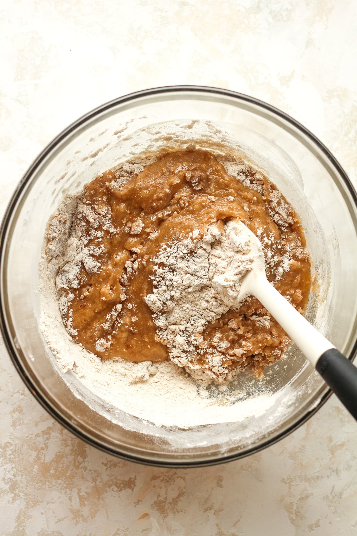 A large bowl with the wet ingredients plus flour.