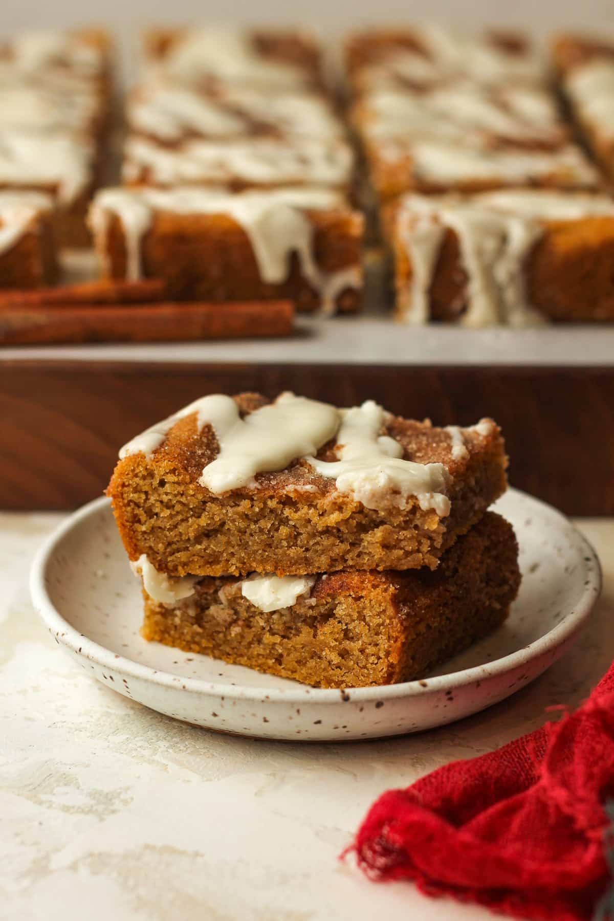 Side view of a small plate of two stacked snickerdoodle bars.