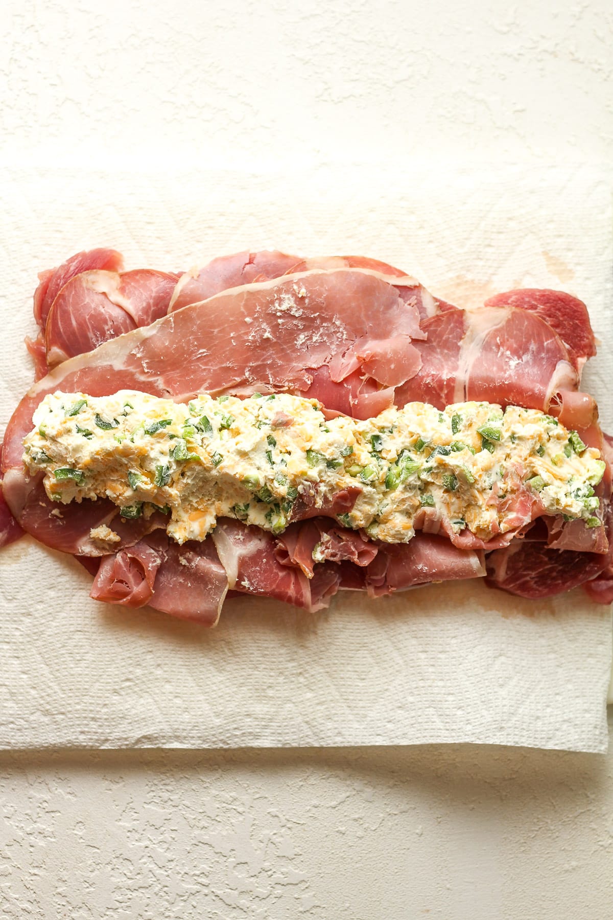 The pork tenderloin split and layered with prosciutto and the cream cheese mixture.