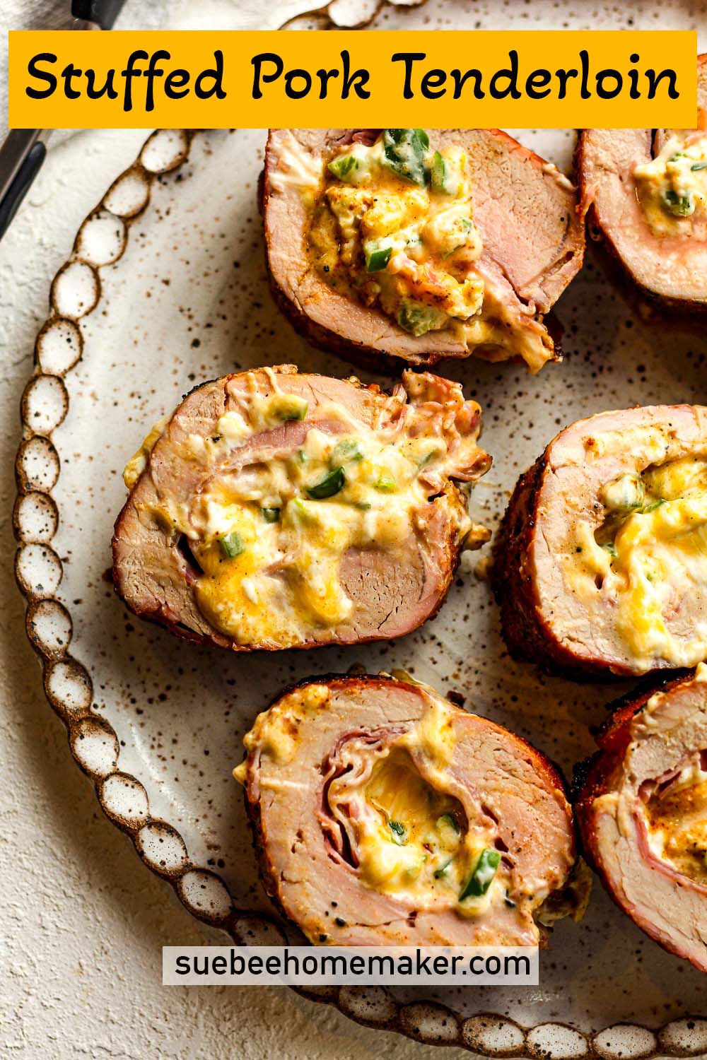 A plate of stuffed pork tenderloin slices.