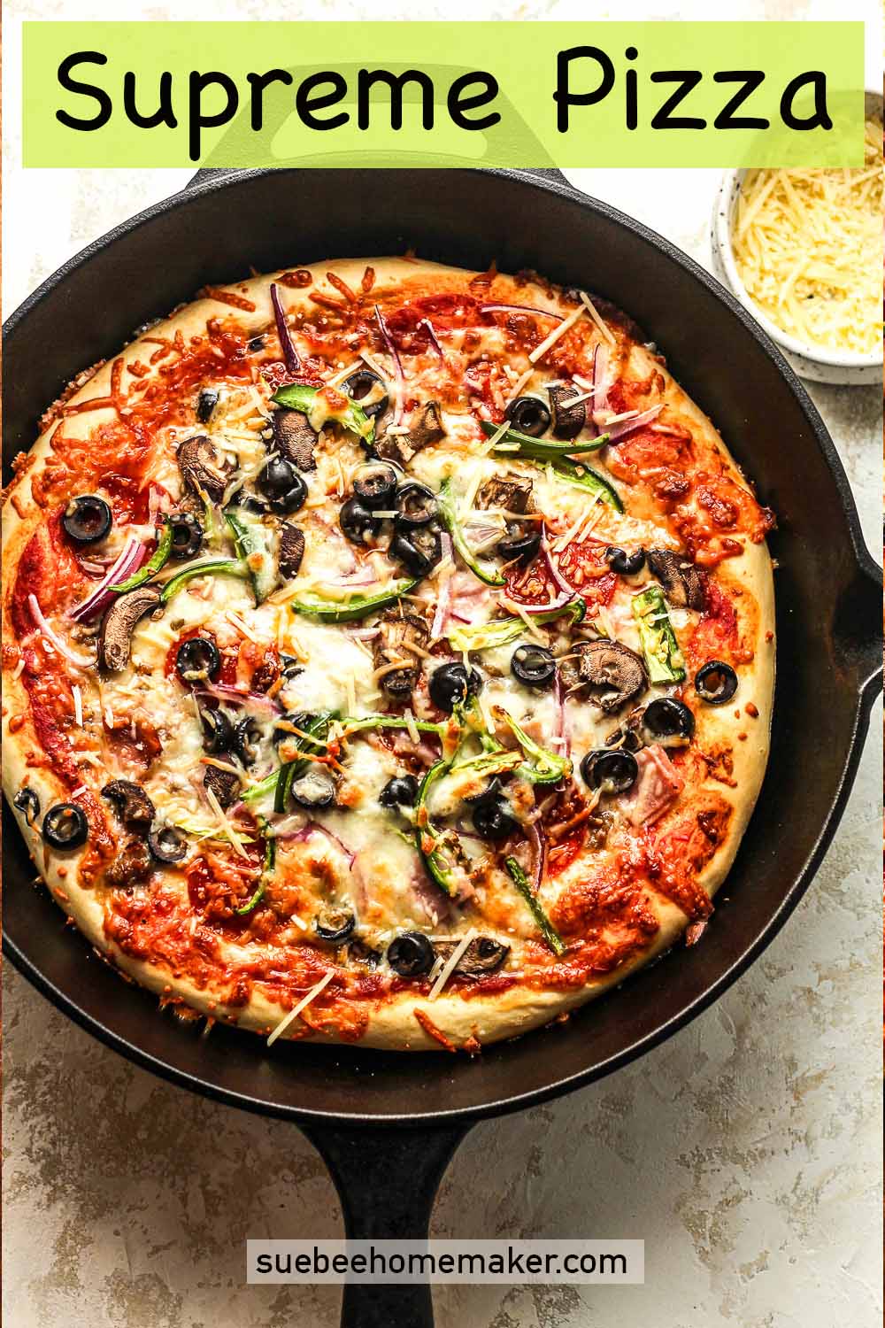 A Supreme pizza in a cast iron skillet.