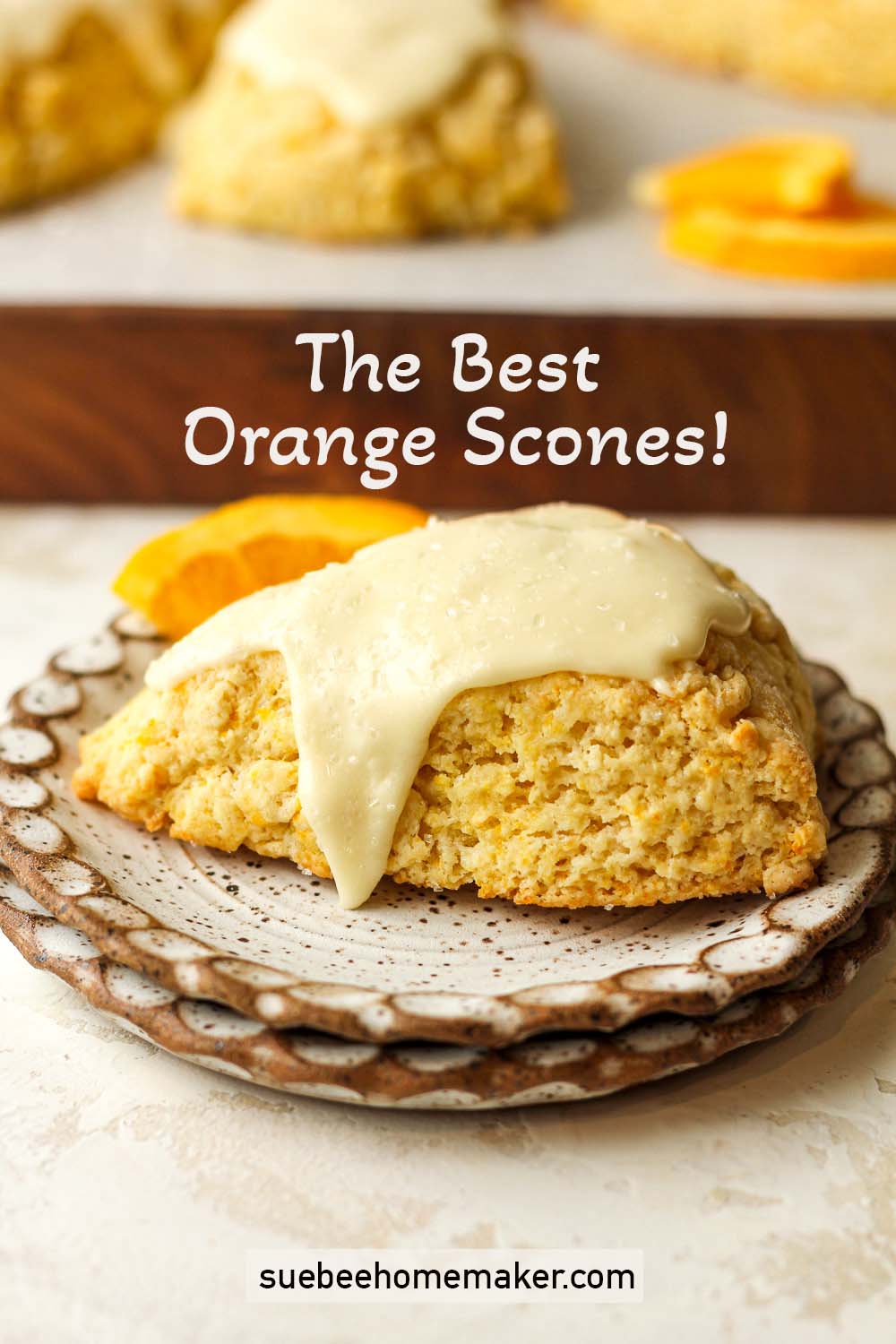 Side view of the best orange scones on a plate.