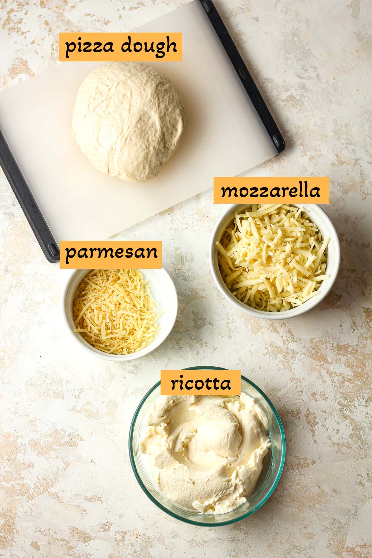 Labeled ingredients for three cheese pizza.