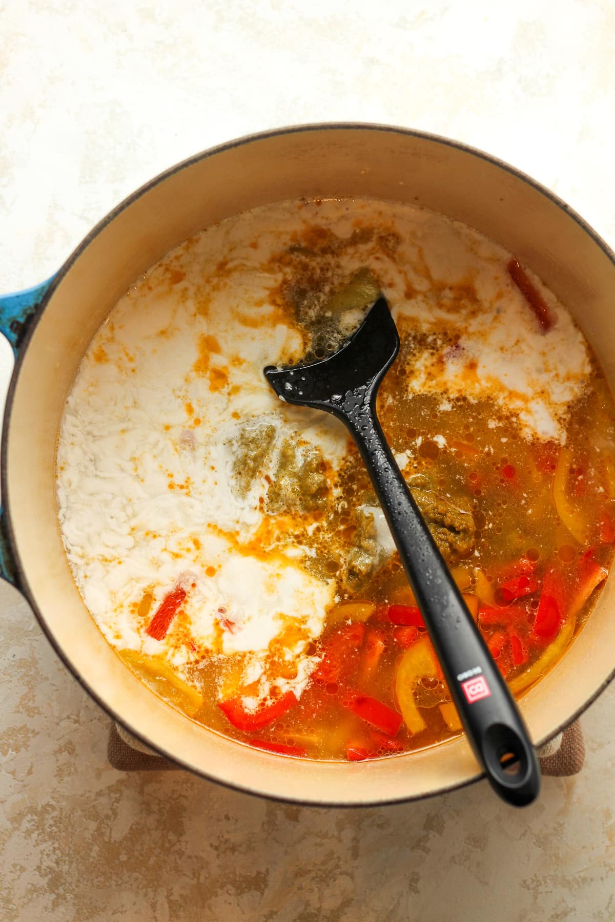 A pot of the curry broth ingredients before stirring.