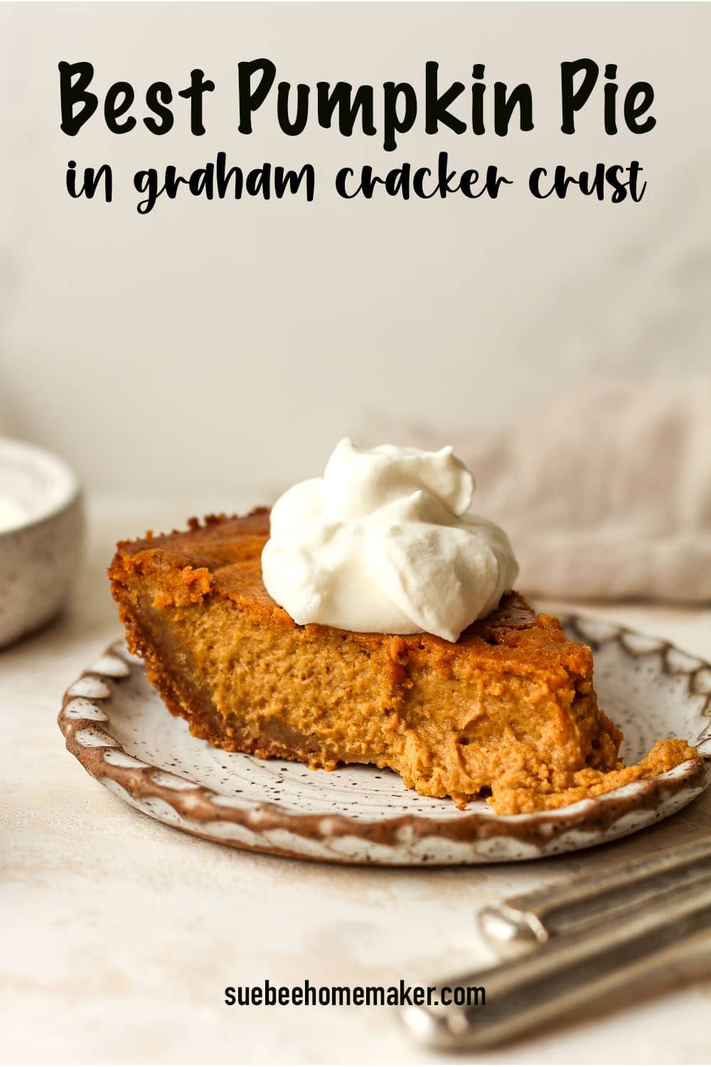 Side view of a small plate with a slice of the Best Pumpkin Pie in graham cracker crust.