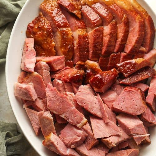 An oblong dish of sliced bone in ham.