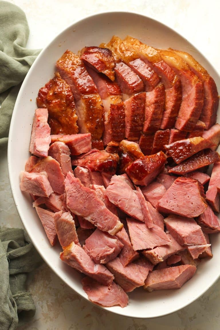 An oblong dish of sliced bone in ham.