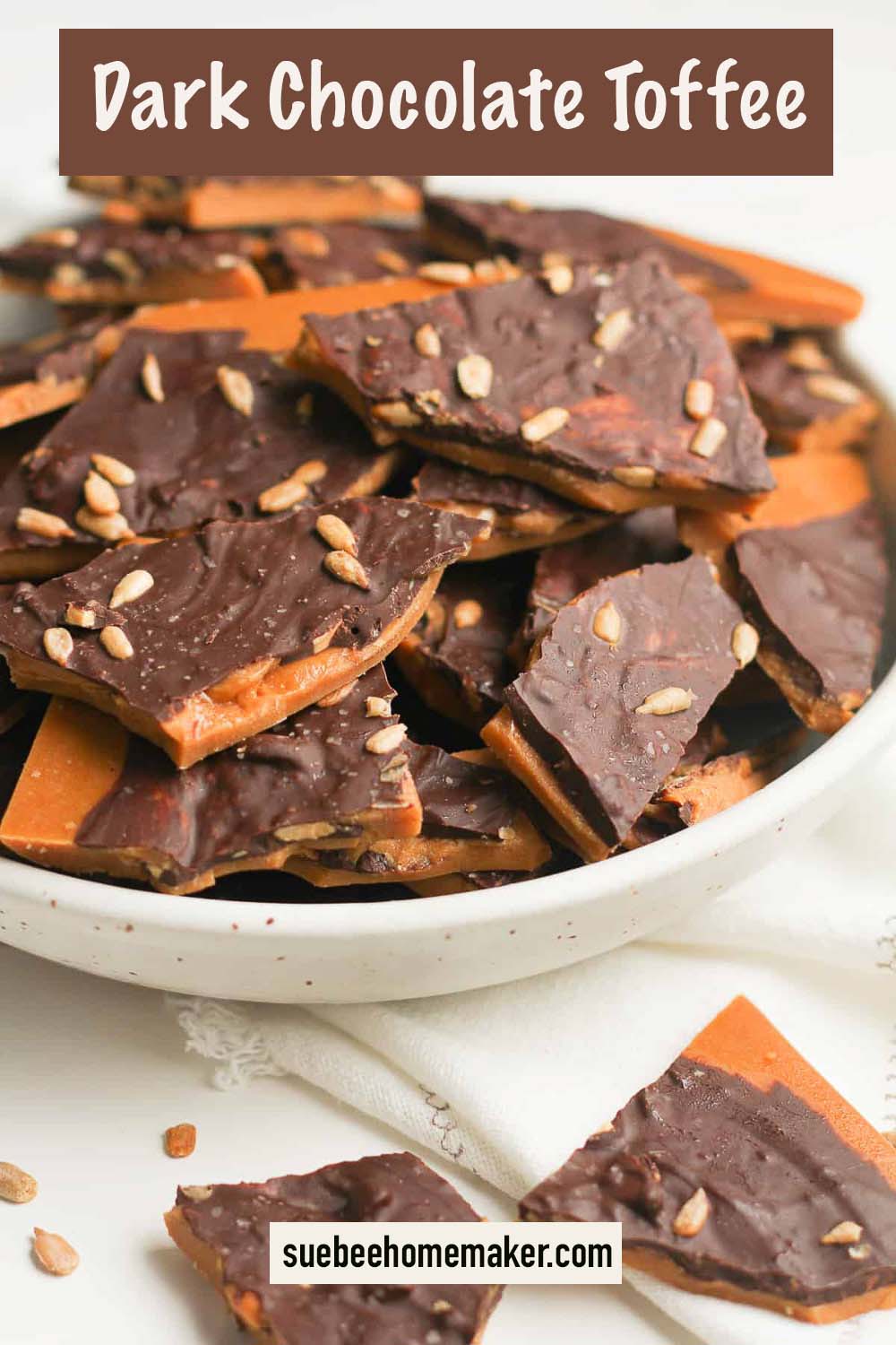 Side view of a bowl of dark chocolate toffee