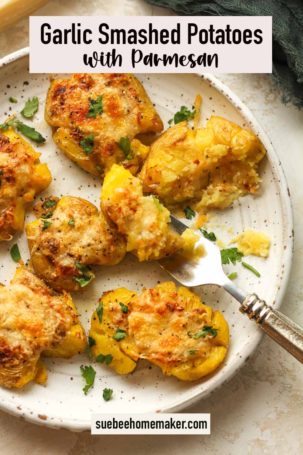 A plate of garlic smashed potatoes with parmesan.