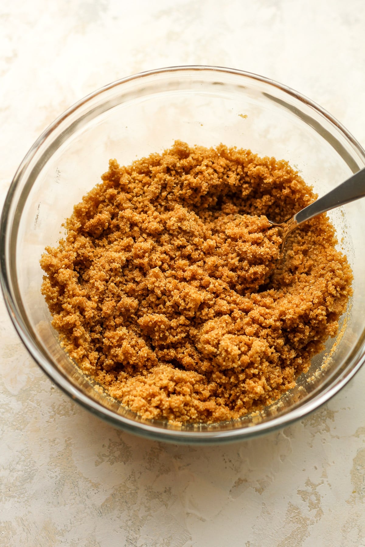 A bowl of the graham cracker crust ingredients.