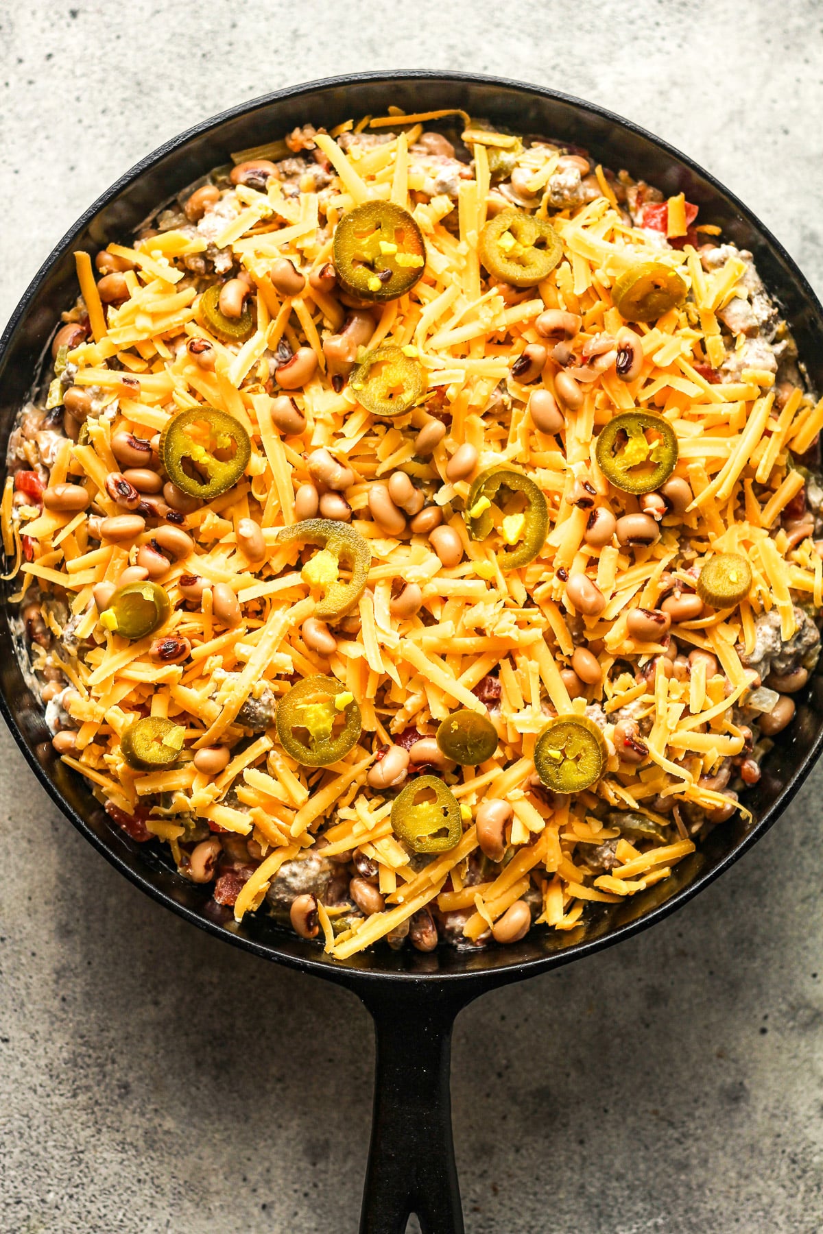 The prepared skillet of dip ready to bake.