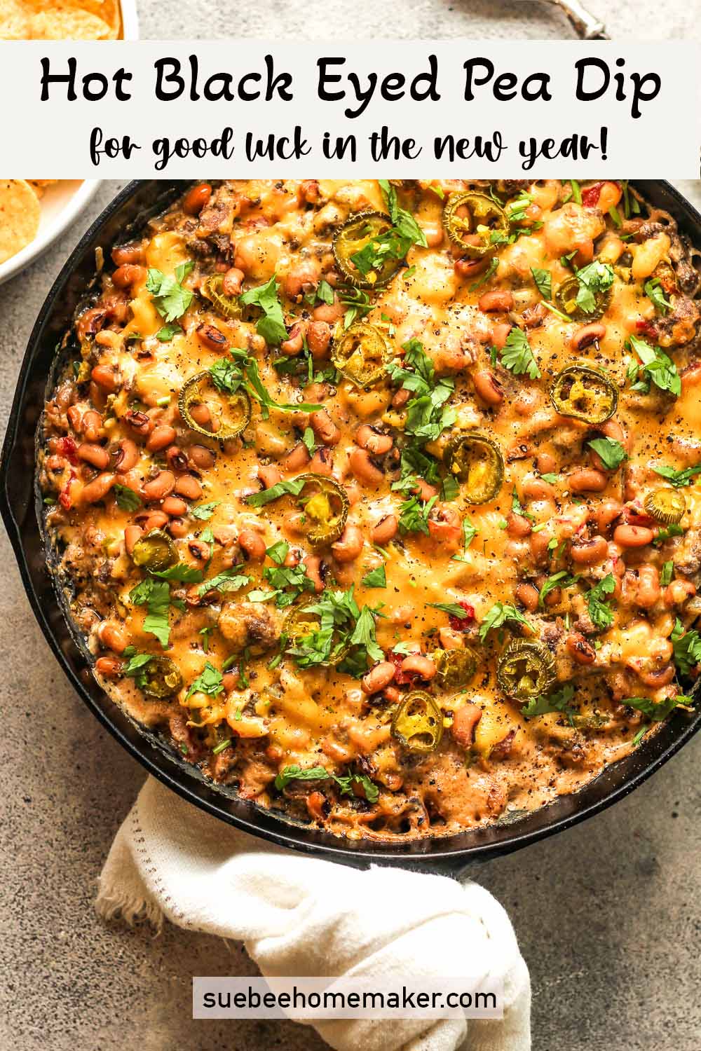 A large skillet of cheesy hot black eyed pea dip.