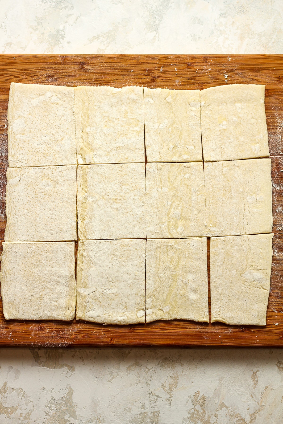 A board with the sliced puff pastry.