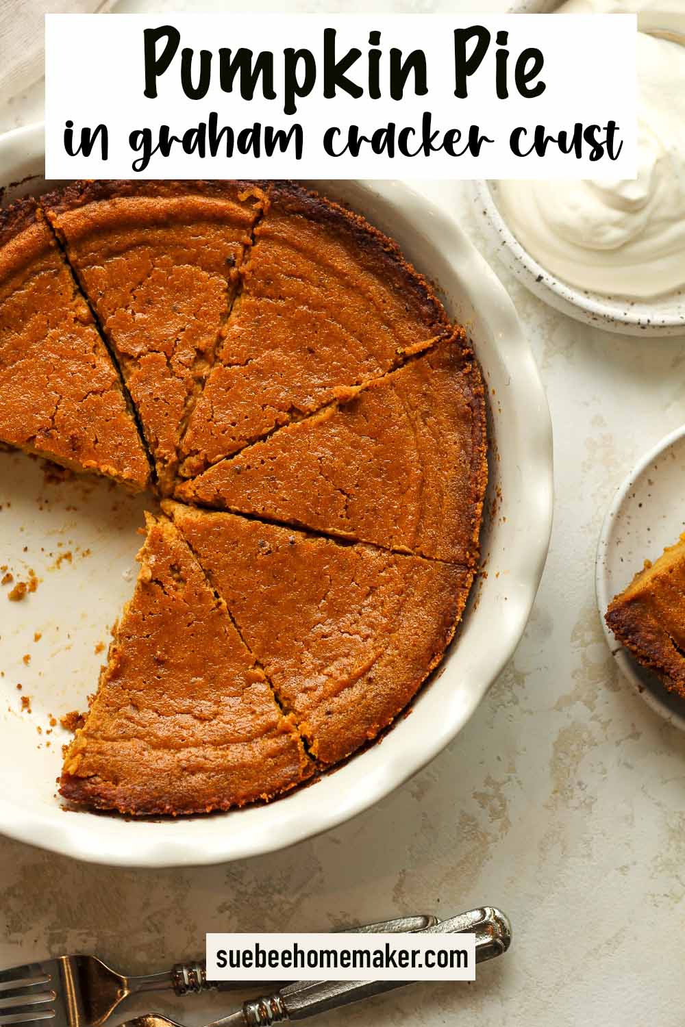 Overhead view of a sliced pumpkin pie in graham cracker crust.