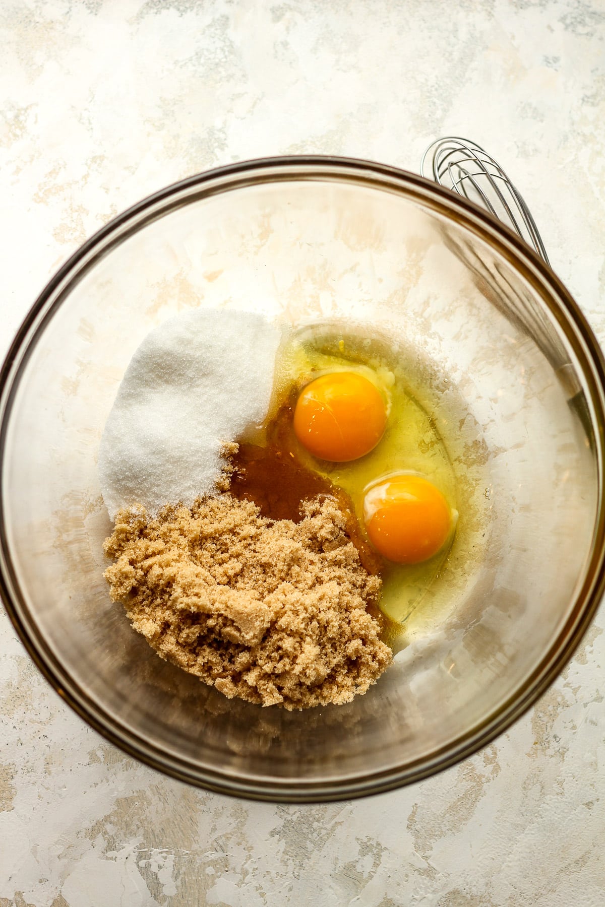 A bowl of the sugars and eggs.