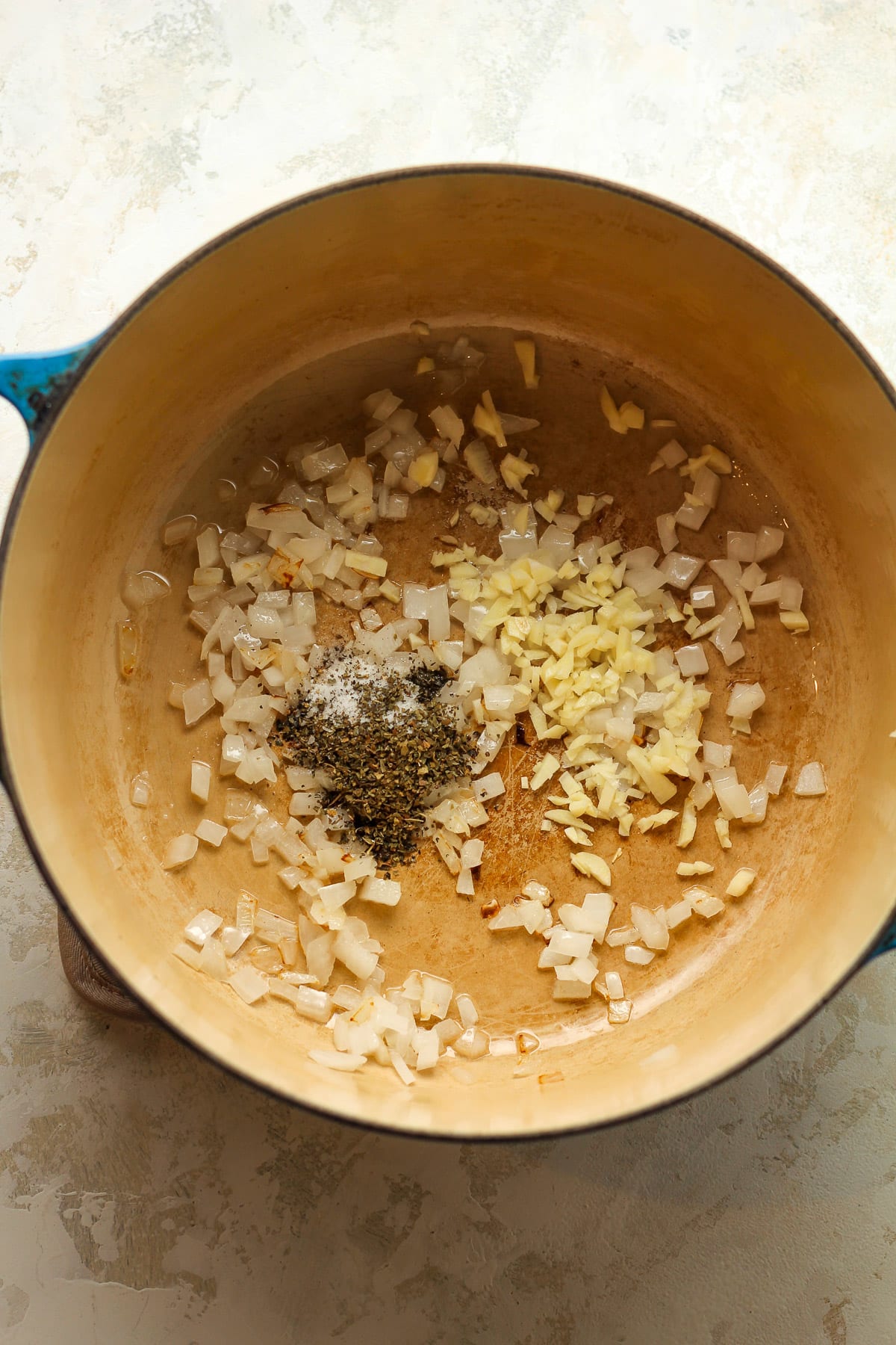 A pot of the sautéed onions, garlic, and seasoning.