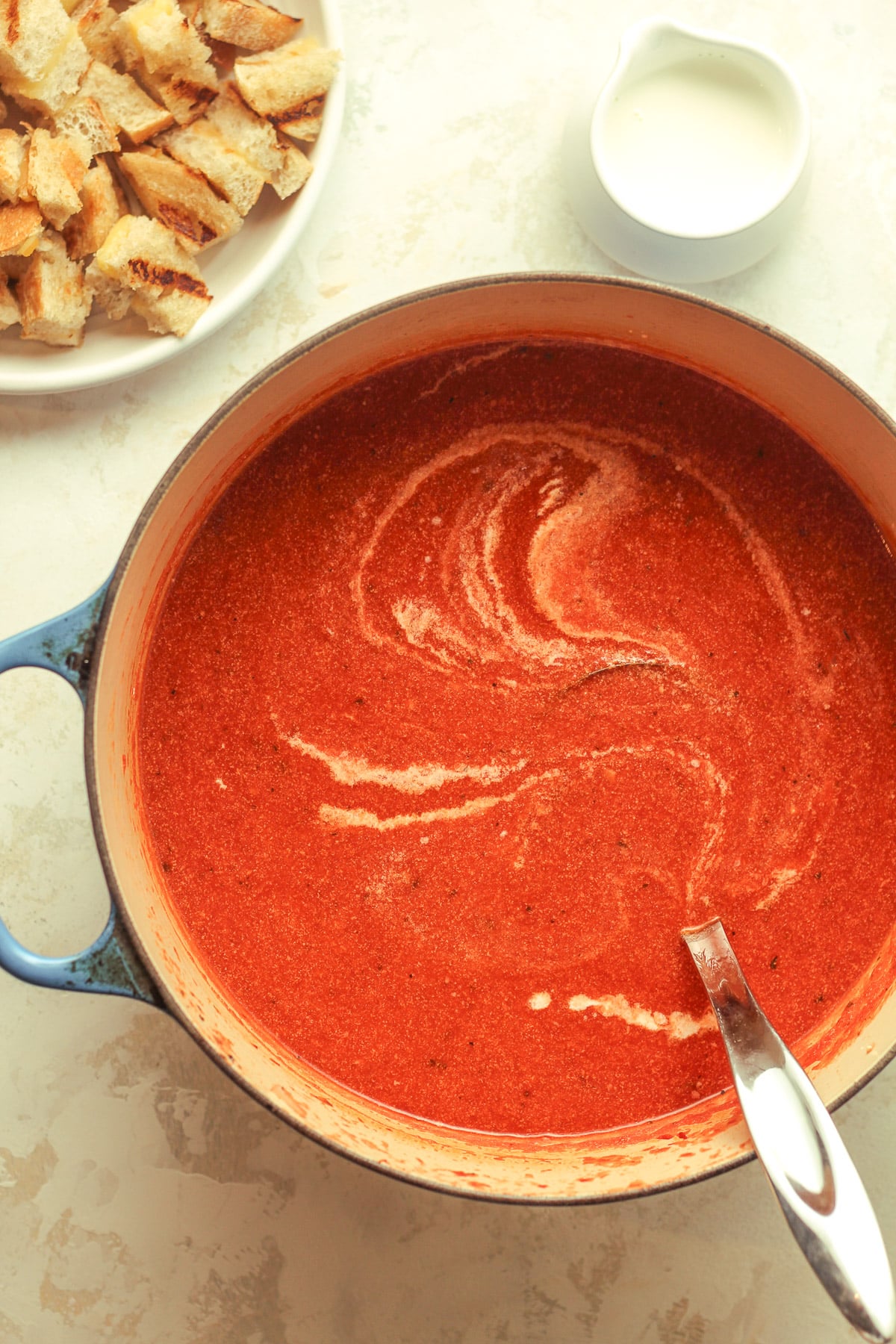 A large pot of tomato soup.